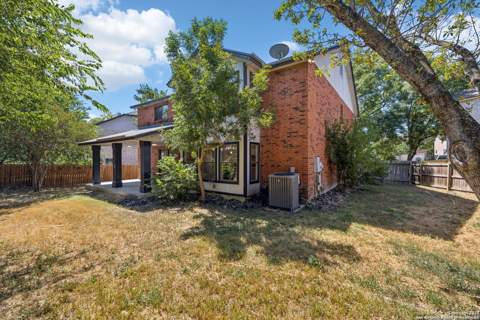 8127 Talkenhorn Converse, TX 78109 - Photo 53 of 57 a view of a house with a yard and large tree