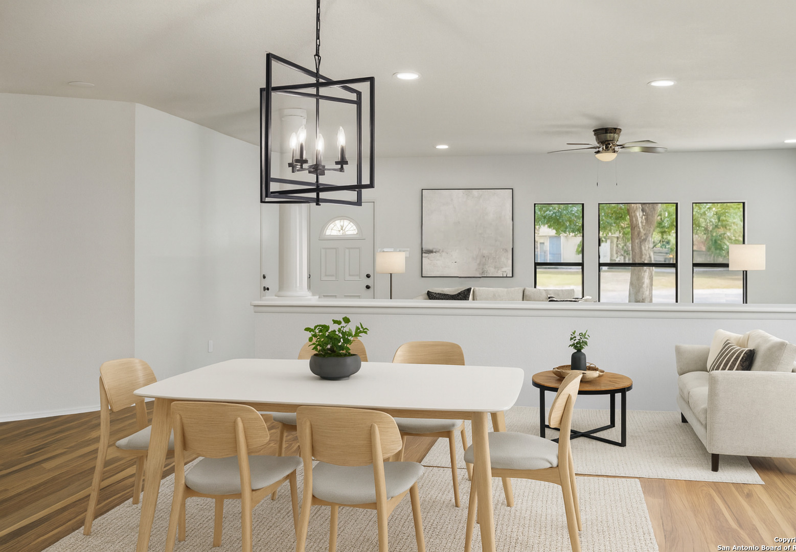 8127 Talkenhorn Converse, TX 78109 - Photo 6 of 57 a kitchen with stainless steel appliances kitchen island granite countertop a table chairs in it and wooden floors