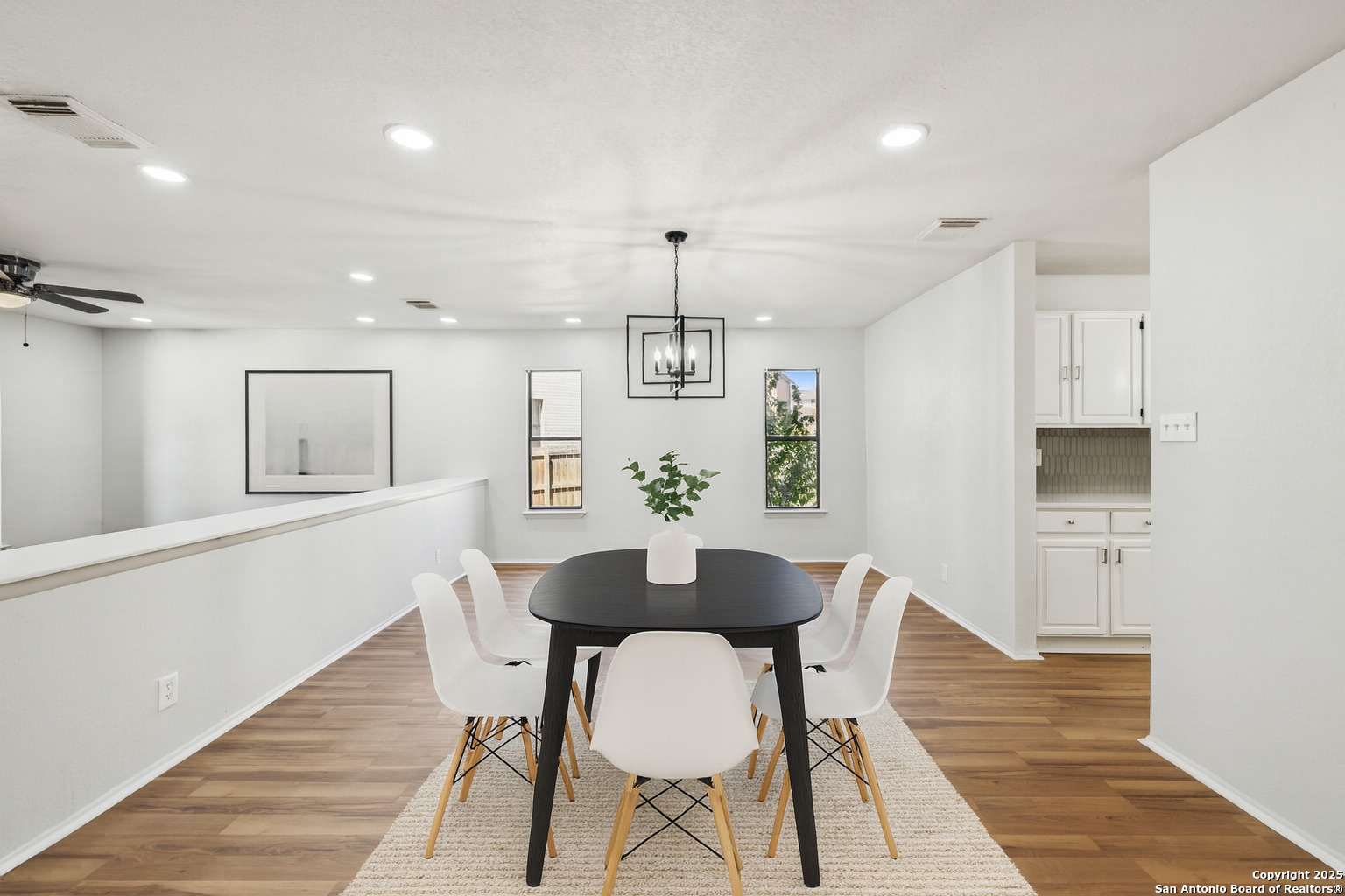 8127 Talkenhorn Converse, TX 78109 - Photo 7 of 57 a view of a dining room with furniture and wooden floor
