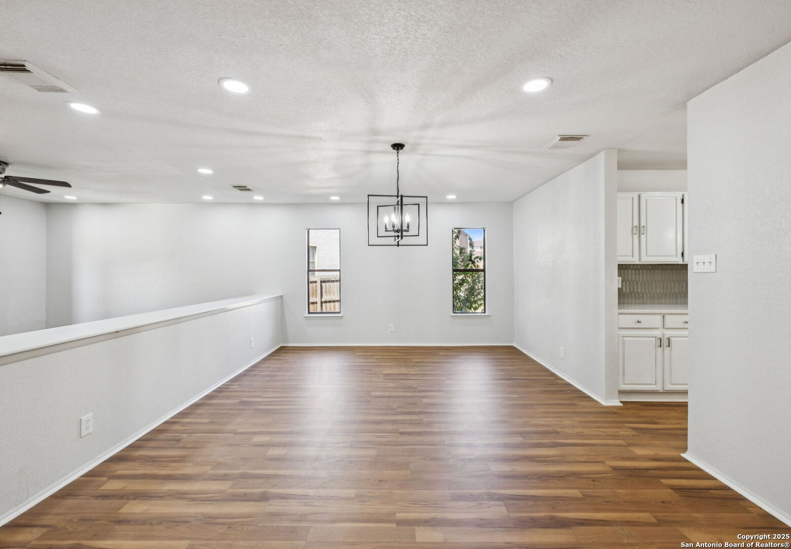 8127 Talkenhorn Converse, TX 78109 - Photo 8 of 57 a view of a kitchen with a dishwasher wooden floor and a refrigerator