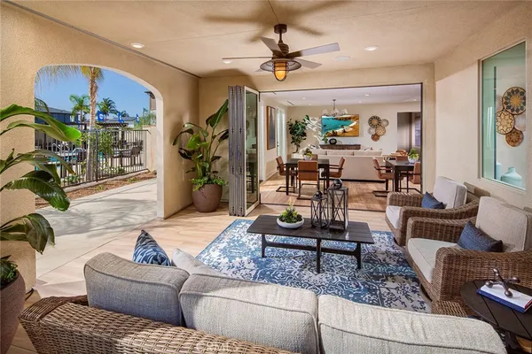 a living room with furniture and a chandelier