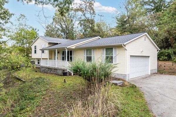 2432 West Hardies Road Gibsonia, PA 15044 - Photo 1 of 50 a front view of a house with garden