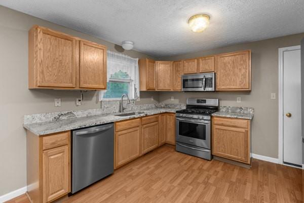 2432 West Hardies Road Gibsonia, PA 15044 - Photo 13 of 50 a kitchen with granite countertop wooden cabinets and a stove top oven
