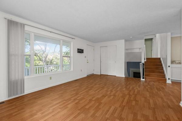 2432 West Hardies Road Gibsonia, PA 15044 - Photo 4 of 50 a view of empty room with wooden floor and fireplace