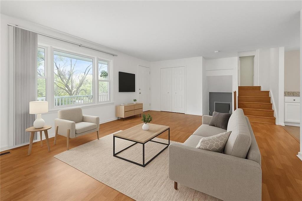 2432 West Hardies Road Gibsonia, PA 15044 - Photo 5 of 50 a living room with furniture and a flat screen tv