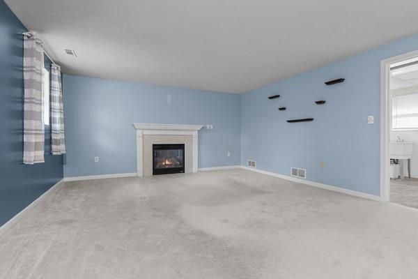 2432 West Hardies Road Gibsonia, PA 15044 - Photo 8 of 50 an empty room with fireplace and windows