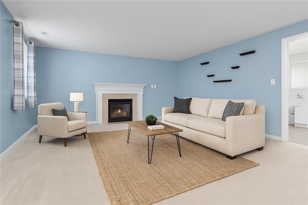 2432 West Hardies Road Gibsonia, PA 15044 - Photo 9 of 50 a living room with furniture and a fireplace