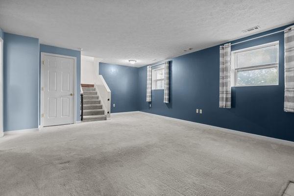 2432 West Hardies Road Gibsonia, PA 15044 - Photo 10 of 50 a view of an empty room with window and stairs