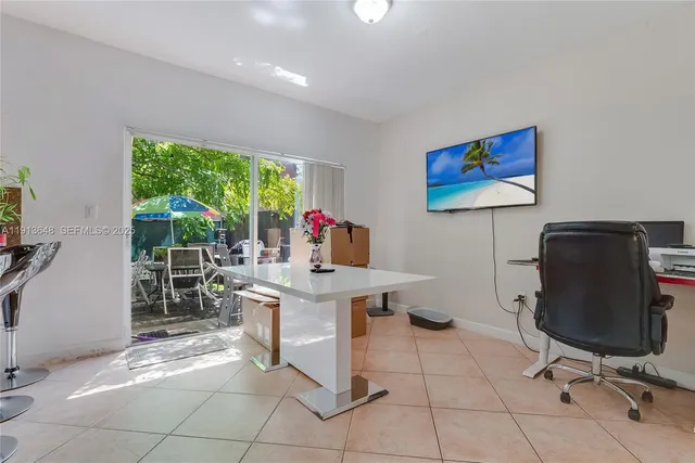 a workspace with furniture and a window