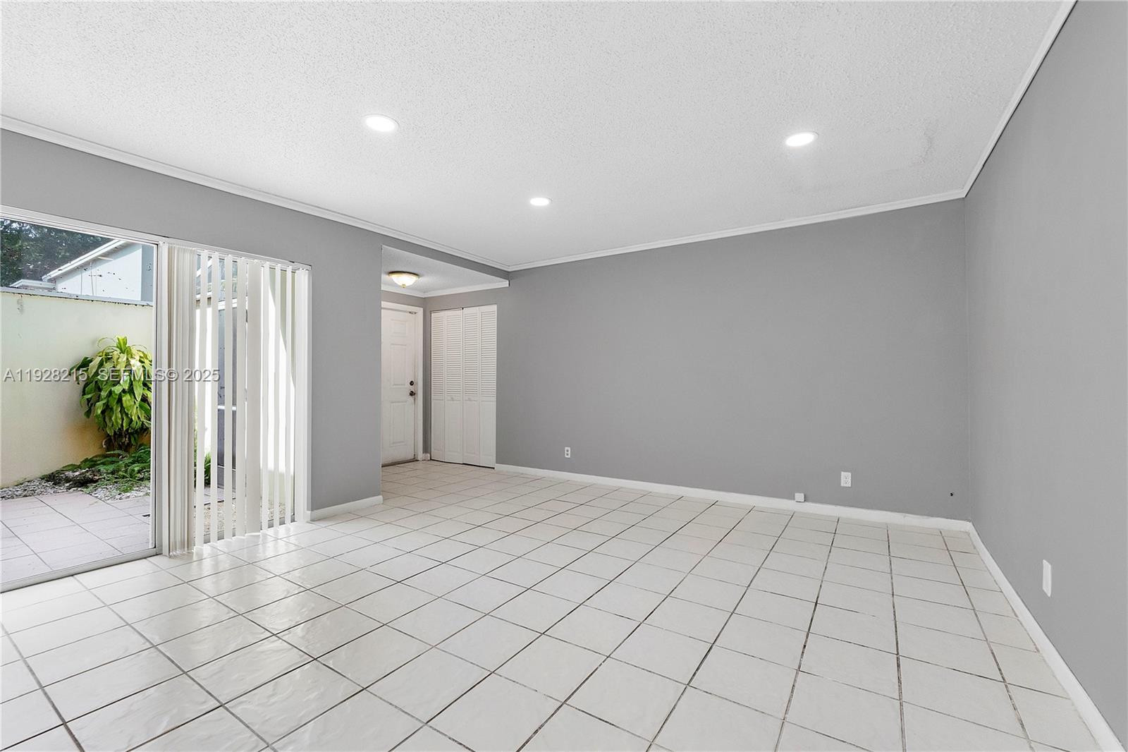 5850 Northwest 57th Avenue, Unit 1 Tamarac, FL 33319 - Photo 20 of 56 a view of an empty room