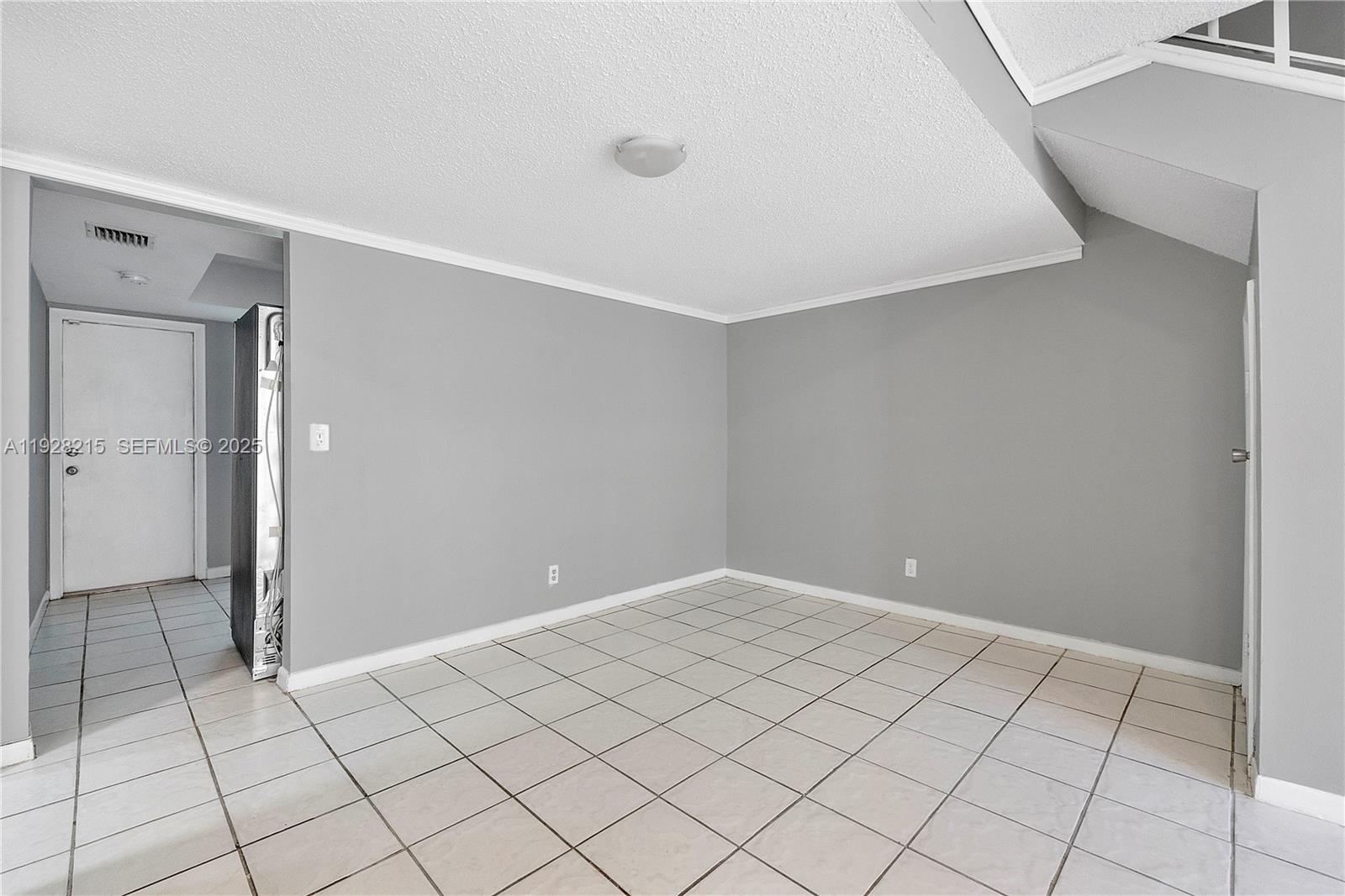 5850 Northwest 57th Avenue, Unit 1 Tamarac, FL 33319 - Photo 22 of 56 a view of an empty room
