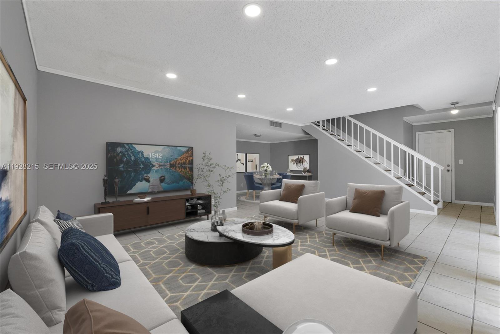 5850 Northwest 57th Avenue, Unit 1 Tamarac, FL 33319 - Photo 3 of 56 a living room with furniture and a view of kitchen