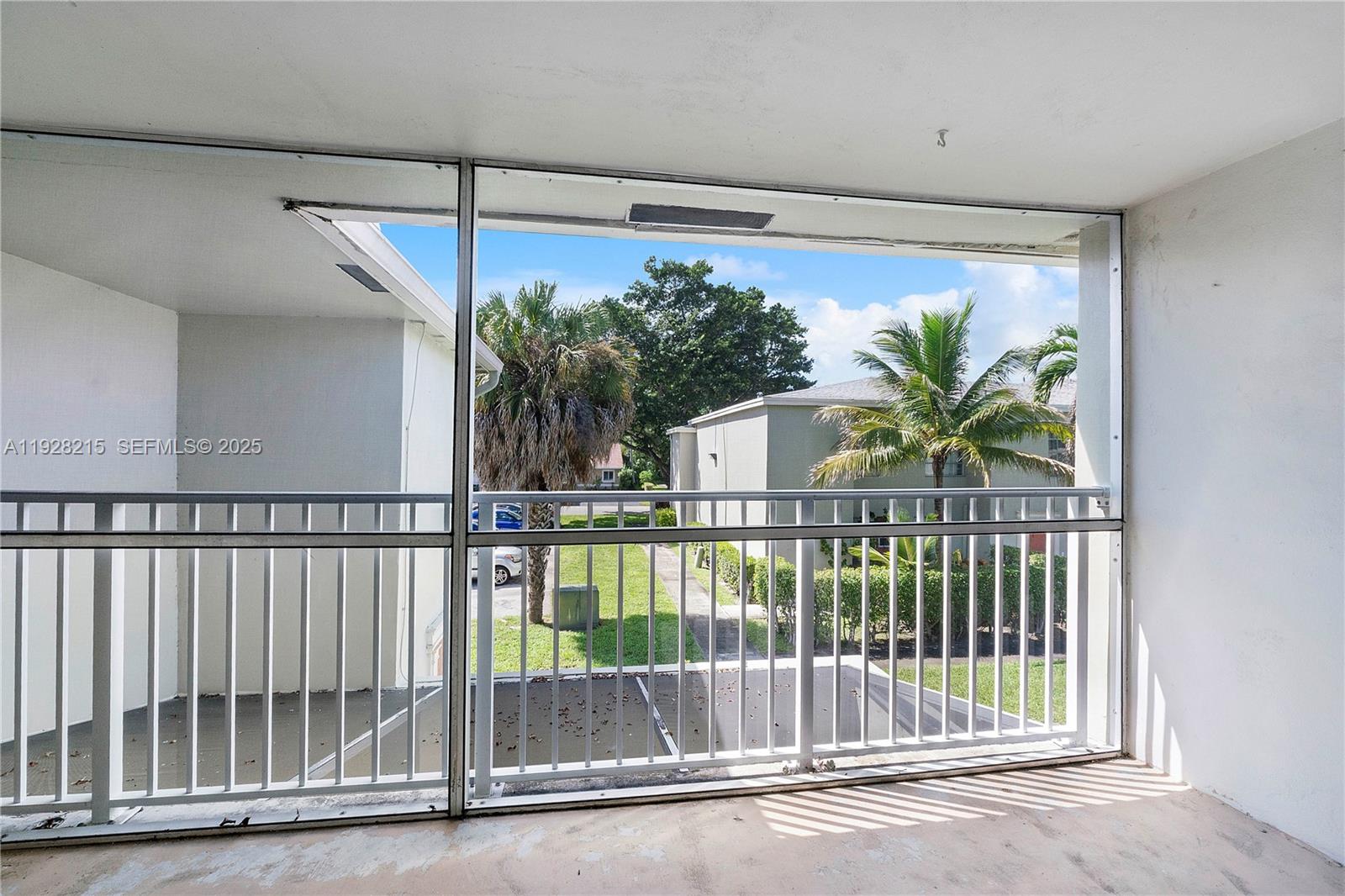 5850 Northwest 57th Avenue, Unit 1 Tamarac, FL 33319 - Photo 41 of 56 a view of a balcony with a plant