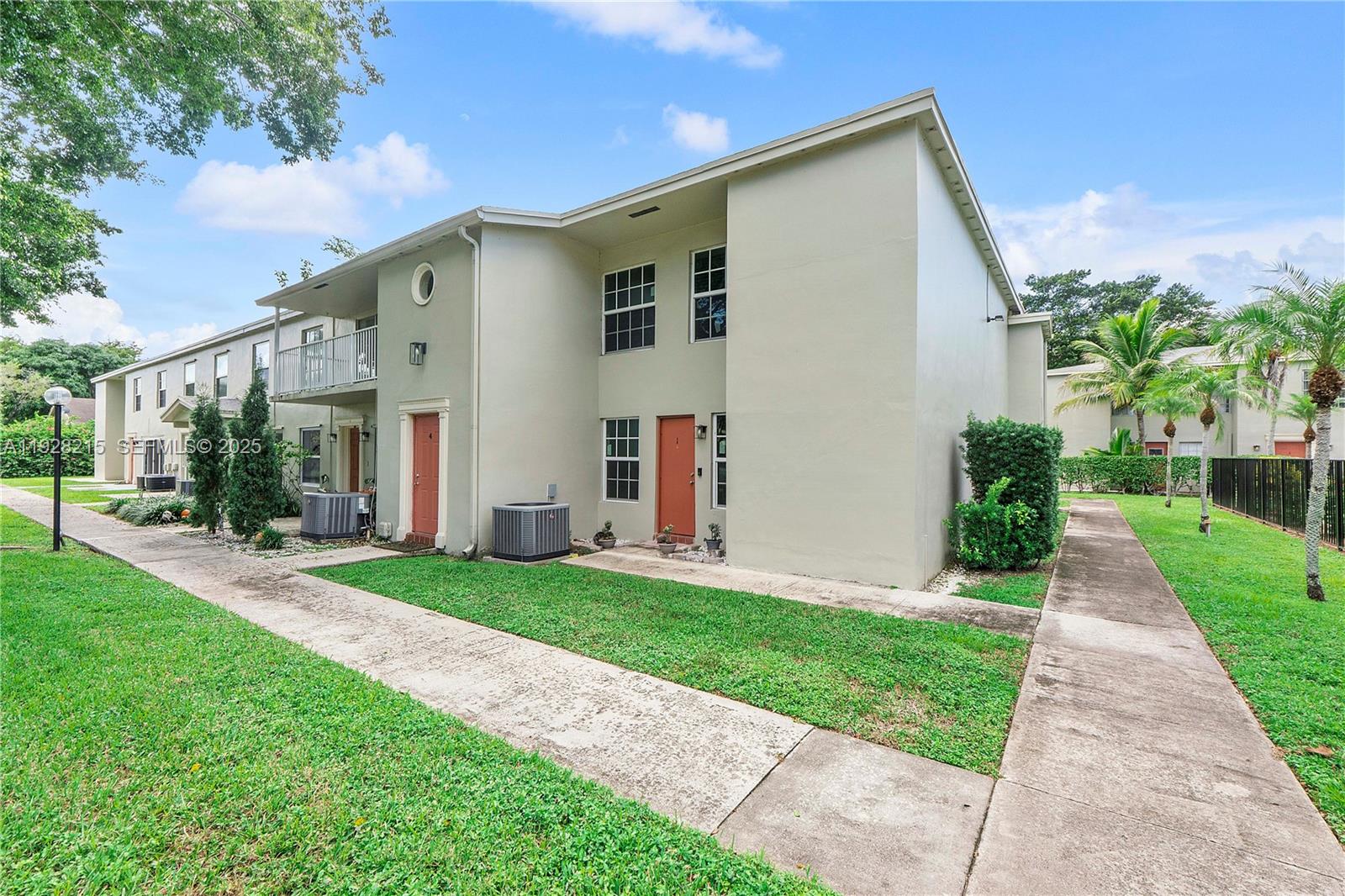5850 Northwest 57th Avenue, Unit 1 Tamarac, FL 33319 - Photo 46 of 56 a front view of house with yard