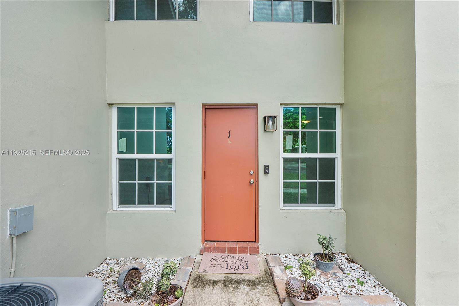 5850 Northwest 57th Avenue, Unit 1 Tamarac, FL 33319 - Photo 48 of 56 a front view of a house with a window