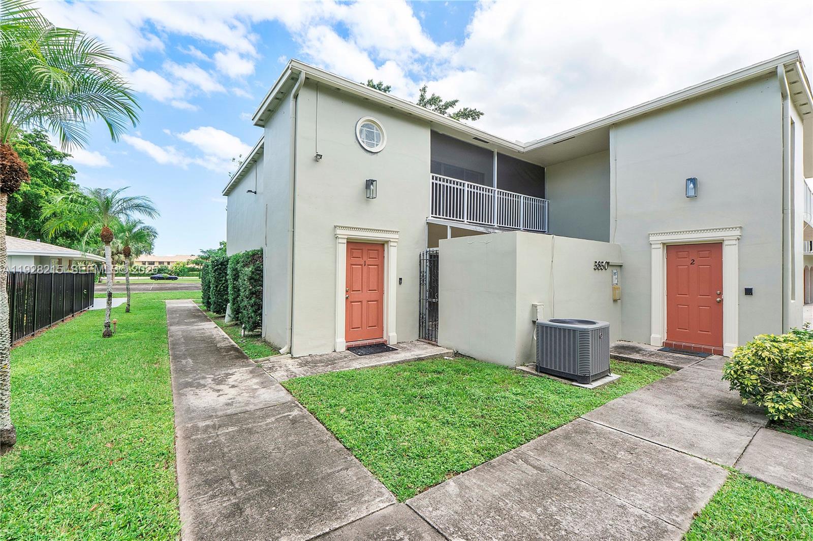 5850 Northwest 57th Avenue, Unit 1 Tamarac, FL 33319 - Photo 49 of 56 a view of backyard with a garden and plants