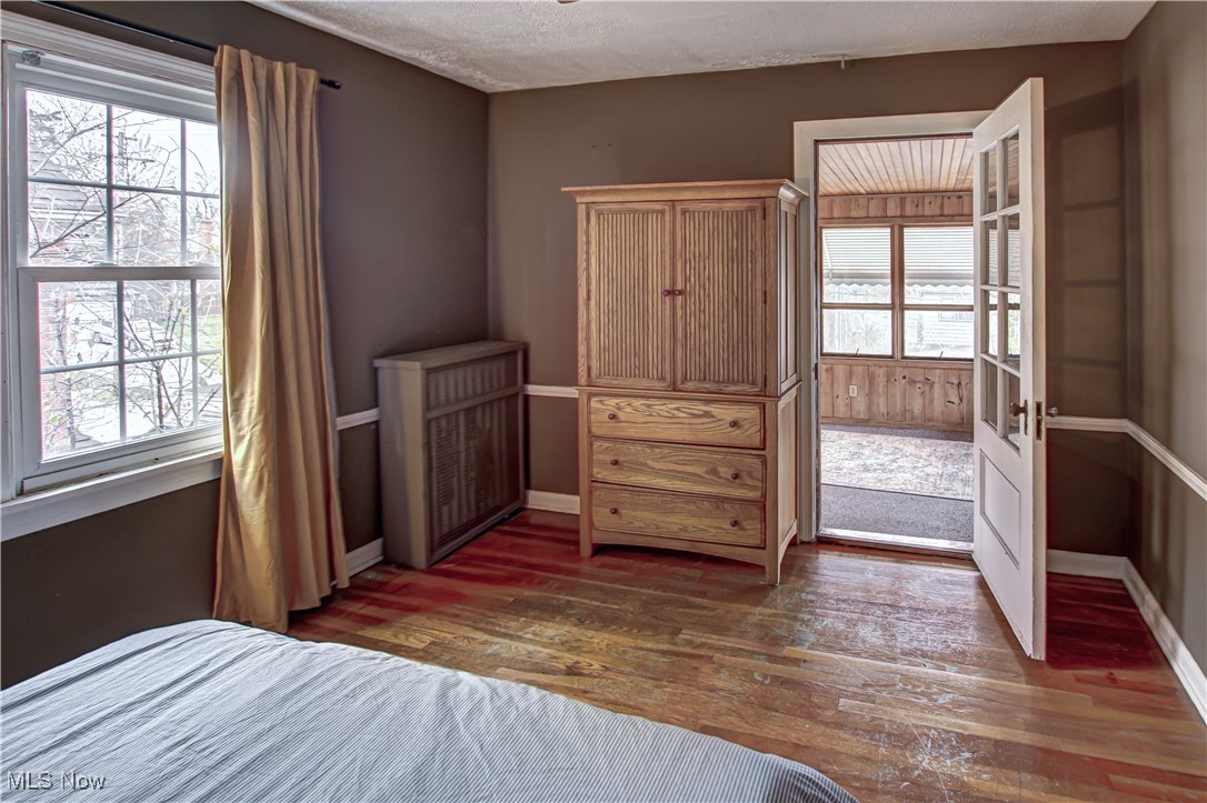 17800 Winslow Road Beachwood, OH 44122 - Photo 18 of 31 Bedroom featuring a textured ceiling and dark hardwood / wood-style flooring