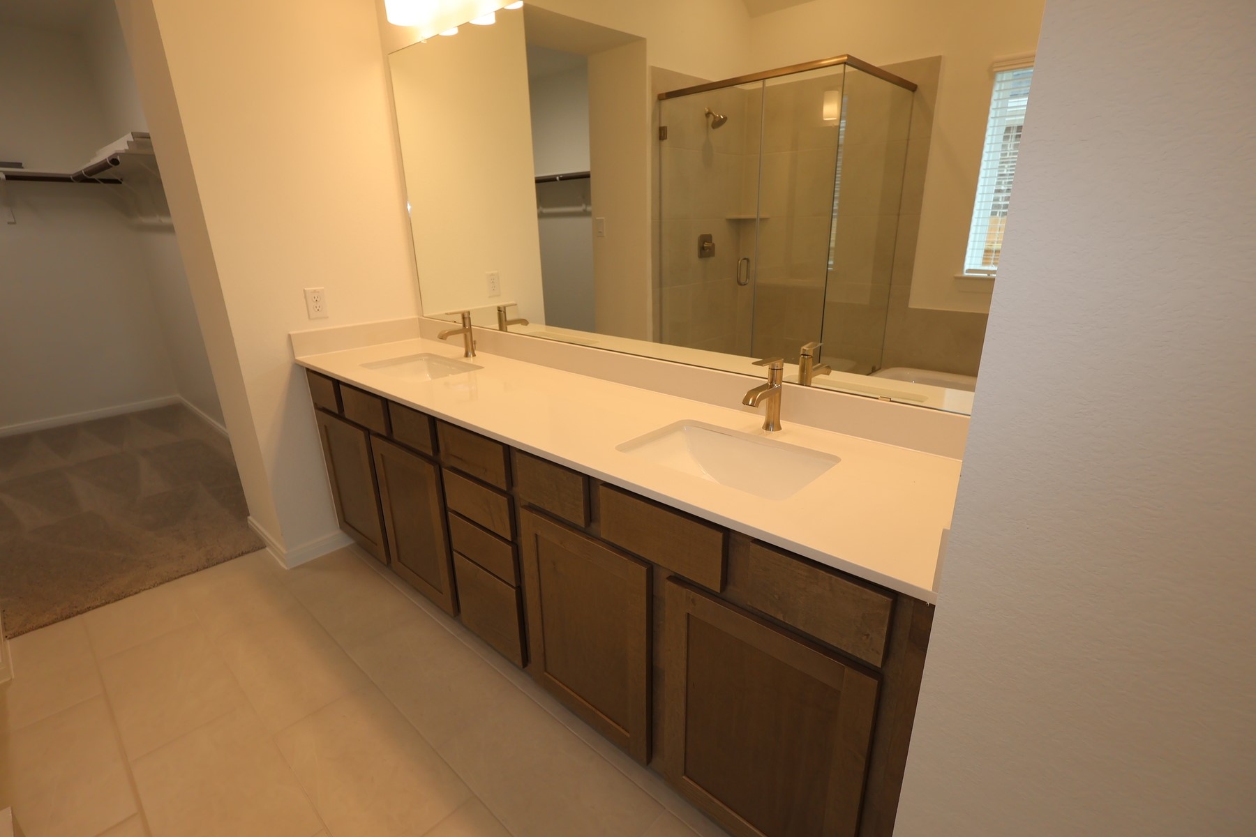 134 Afton June Drive Rosenberg, TX 77471 - Photo 11 of 17 a bathroom with a double vanity sink and mirror