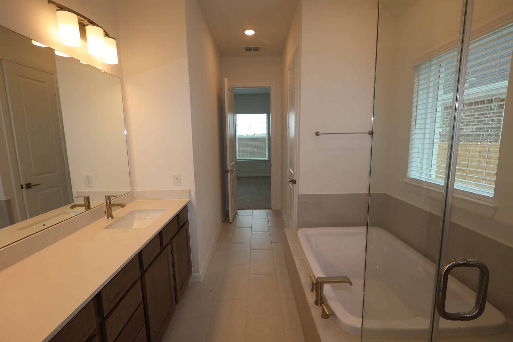 134 Afton June Drive Rosenberg, TX 77471 - Photo 12 of 17 a bathroom with a bathtub and a sink
