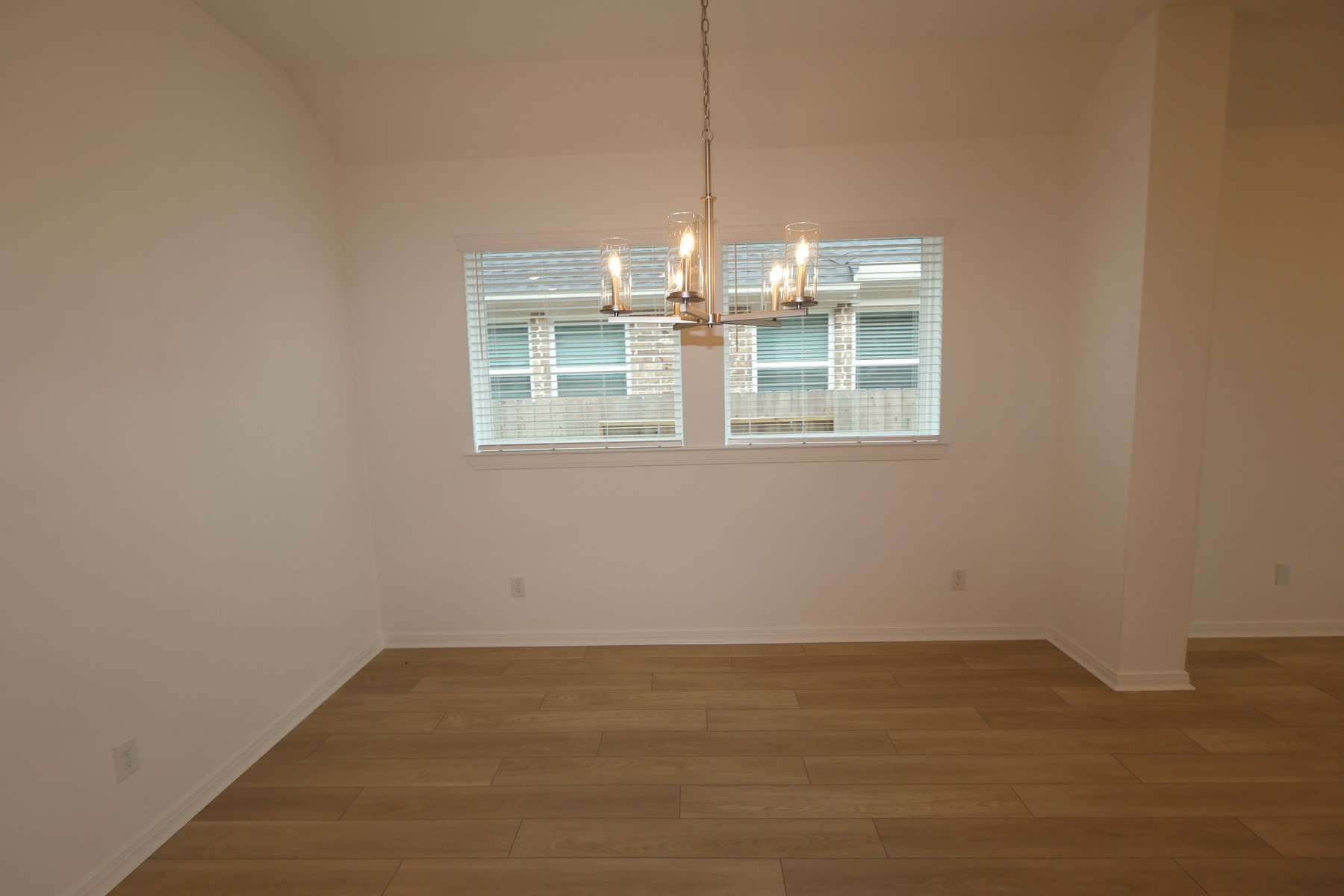 134 Afton June Drive Rosenberg, TX 77471 - Photo 6 of 17 an empty room with wooden floor and windows