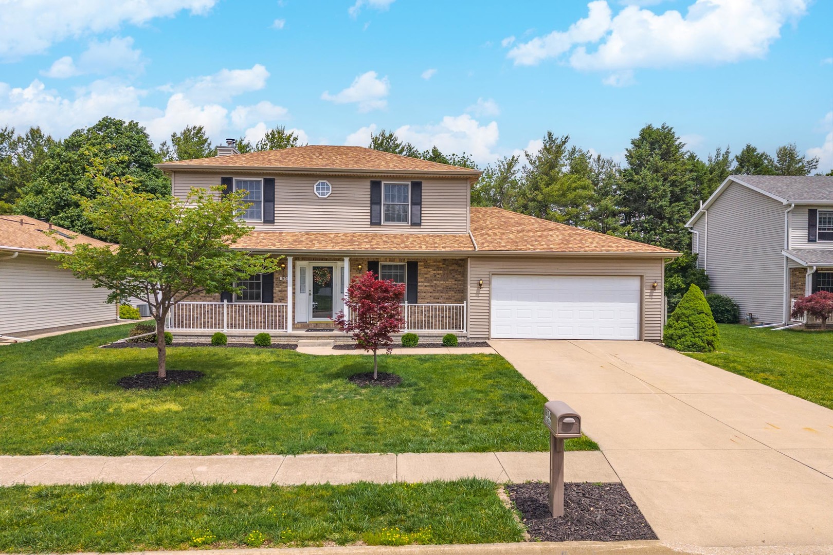 814 Landau Lane Normal, IL 61761 - Photo 1 of 58 a front view of a house with a garden and trees
