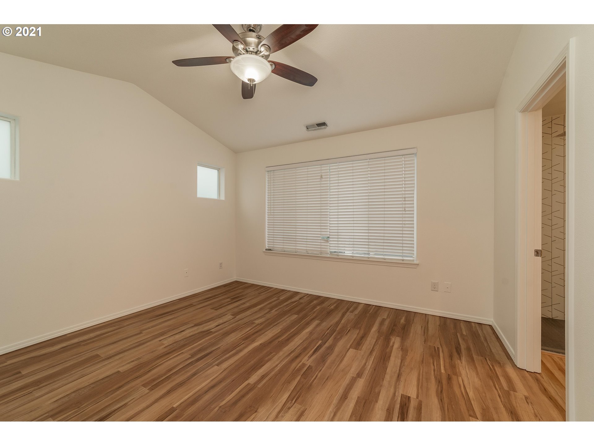 3956 Northwest 12th Avenue Camas, WA 98607 - Photo 13 of 30 an empty room with wooden floor and windows