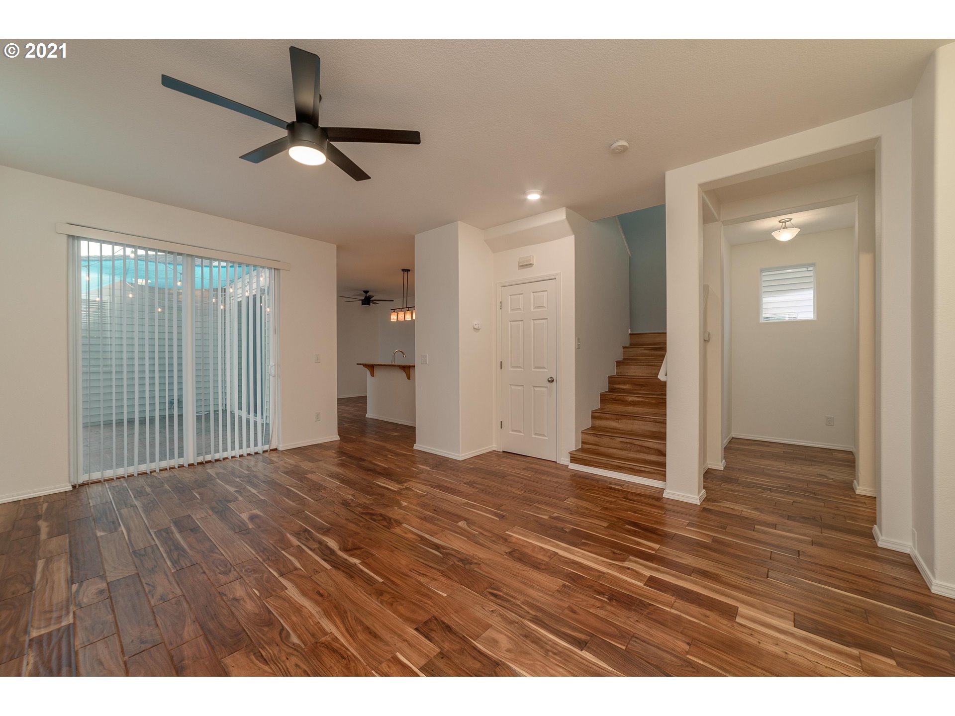 3956 Northwest 12th Avenue Camas, WA 98607 - Photo 3 of 30 a view of an empty room with wooden floor and a window