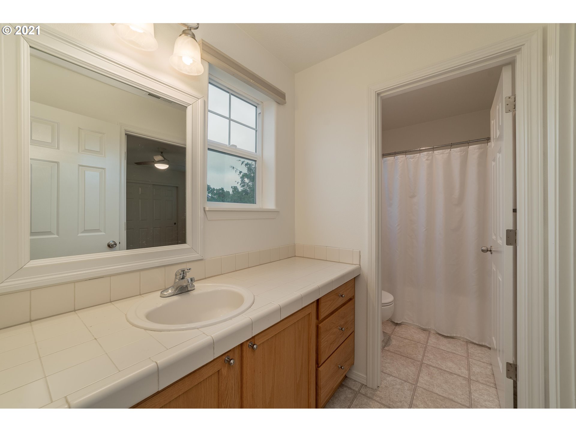 3956 Northwest 12th Avenue Camas, WA 98607 - Photo 22 of 30 a bathroom with a sink and a mirror
