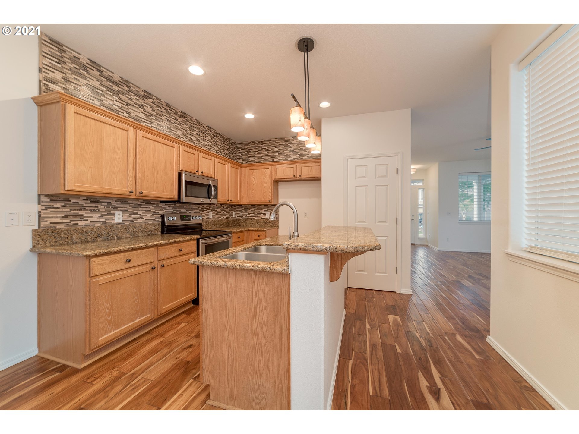 3956 Northwest 12th Avenue Camas, WA 98607 - Photo 8 of 30 a kitchen with cabinets and wooden floor