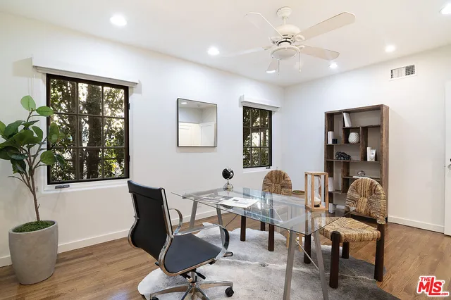 a workspace with furniture and window