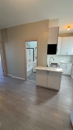 a spacious bathroom with a double vanity sink and a mirror