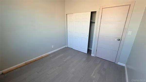 an empty room with wooden floor