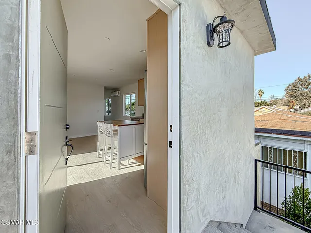 a view of a living room with a wooden floor