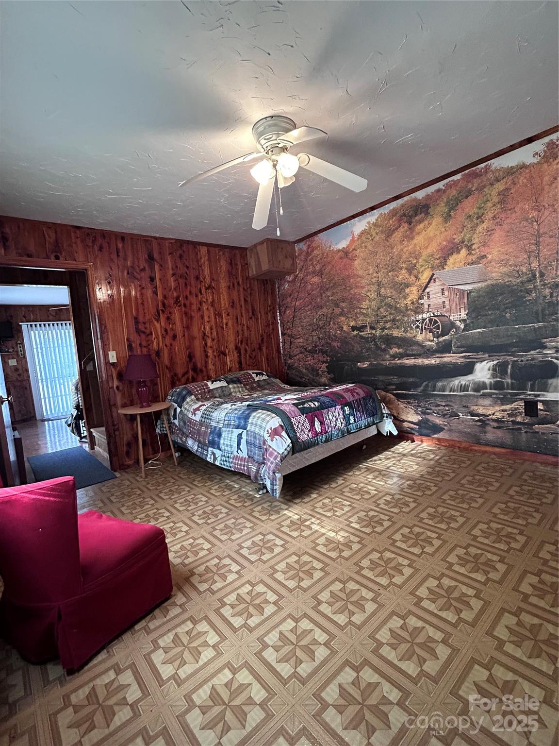 362 Melton Branch Road, Unit A1A6 Bakersville, NC 28705 - Photo 16 of 30 a bedroom with a bed couch and window