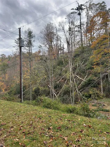 a bedroom with furniture and a chandelier