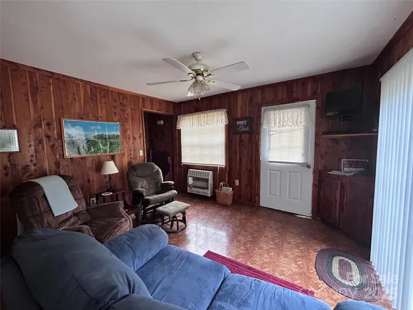 a kitchen with stainless steel appliances granite countertop a refrigerator a sink dishwasher a stove a microwave oven with cabinets and wooden floor