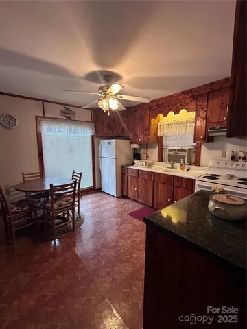 a bathroom with a toilet a sink and a mirror