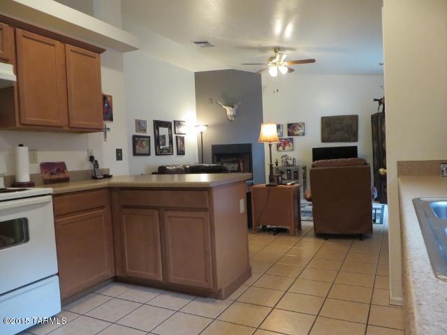 963 Calle Amarillo Rio Rico, AZ 85648 - Photo 29 of 31 a kitchen with a sink cabinets and appliances