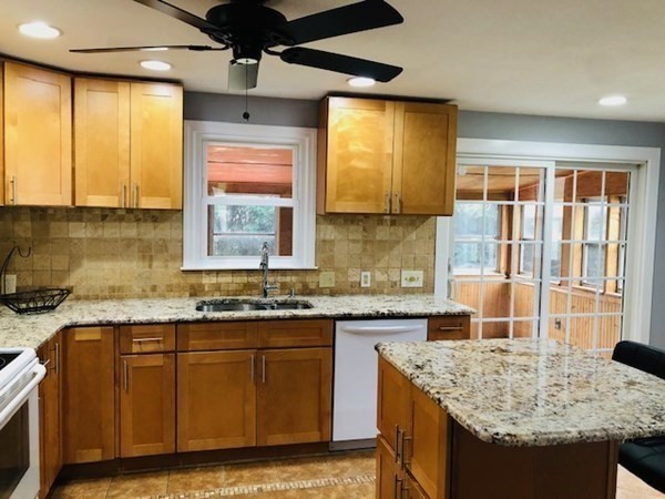 4 Kingsbury Road Webster, MA 01570 - Photo 2 of 22 a kitchen with granite countertop sink stove and cabinets