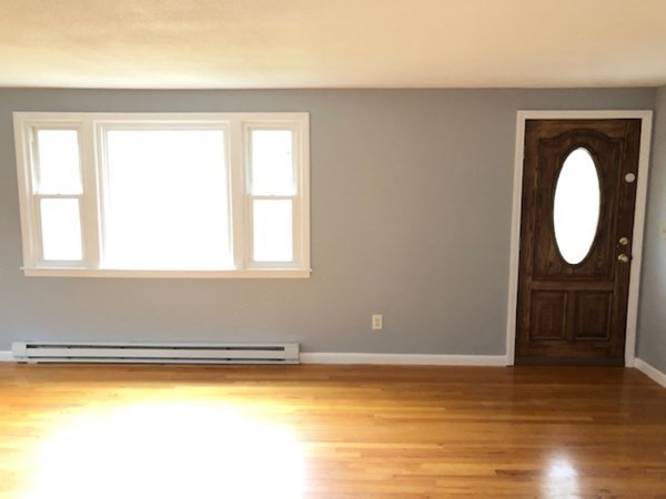4 Kingsbury Road Webster, MA 01570 - Photo 3 of 22 a view of a room with wooden floor and a window