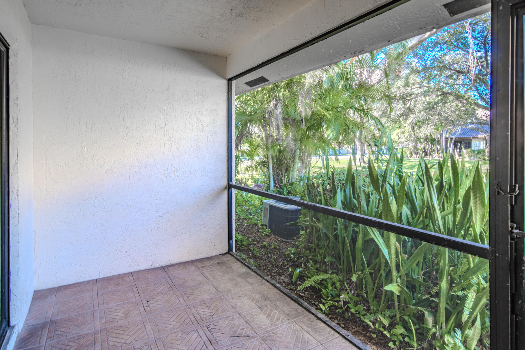 427 Cottonwood Place Boca Raton, FL 33431 - Photo 16 of 30 a balcony with trees in front of it