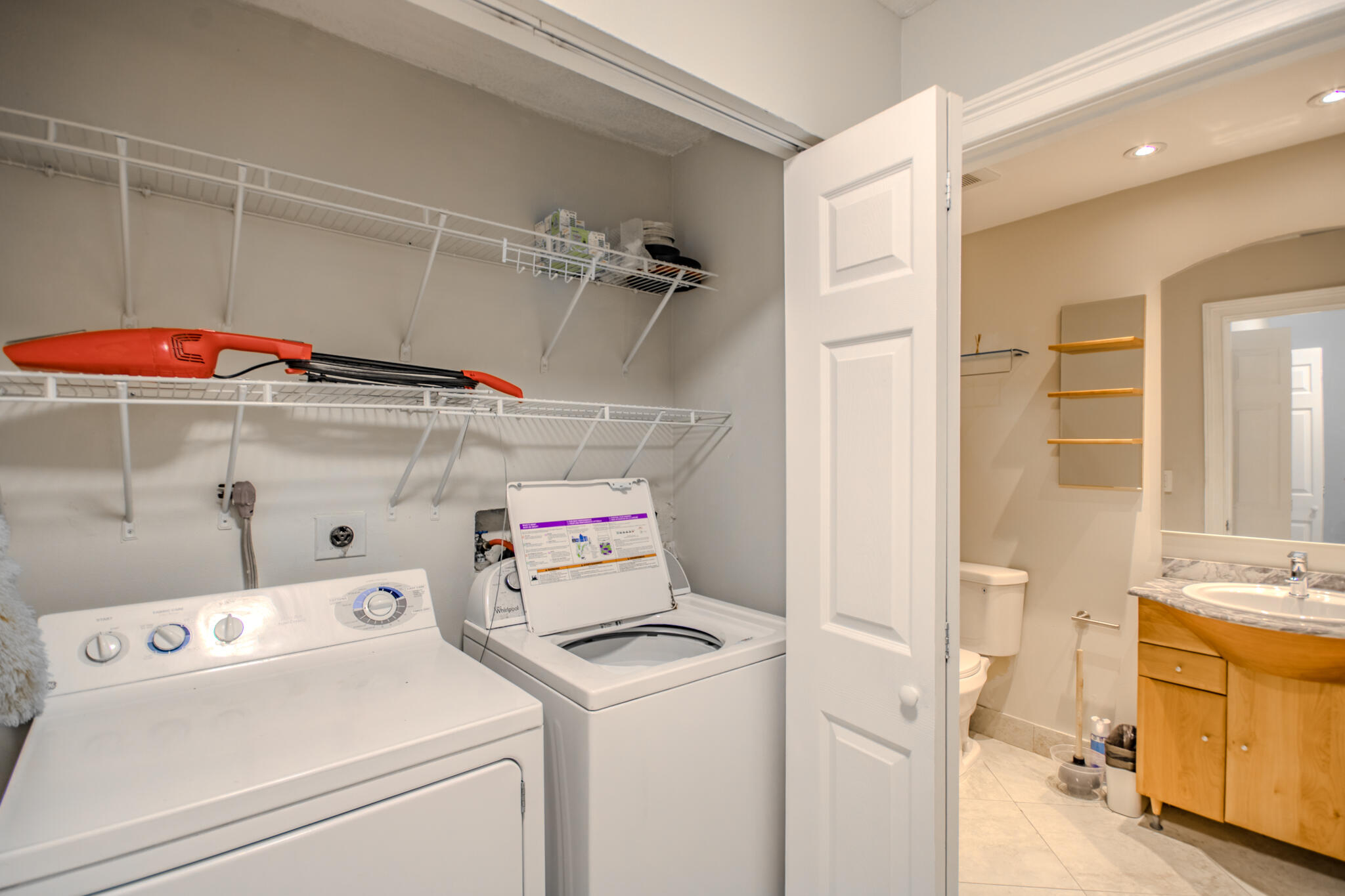 427 Cottonwood Place Boca Raton, FL 33431 - Photo 19 of 30 a view of storage and utility room with washer and dryer