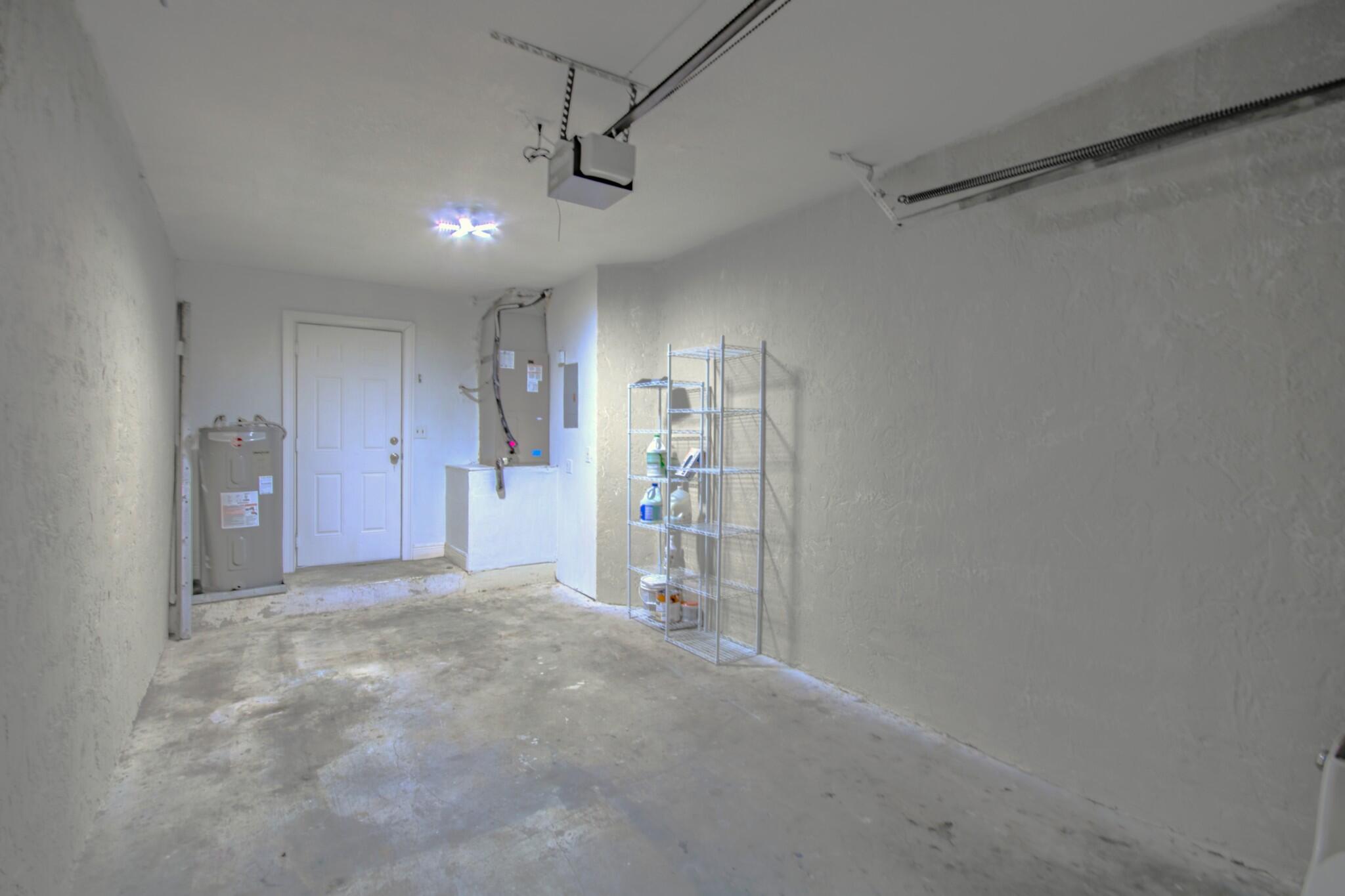 427 Cottonwood Place Boca Raton, FL 33431 - Photo 24 of 30 a view of empty room with wooden floor and windows