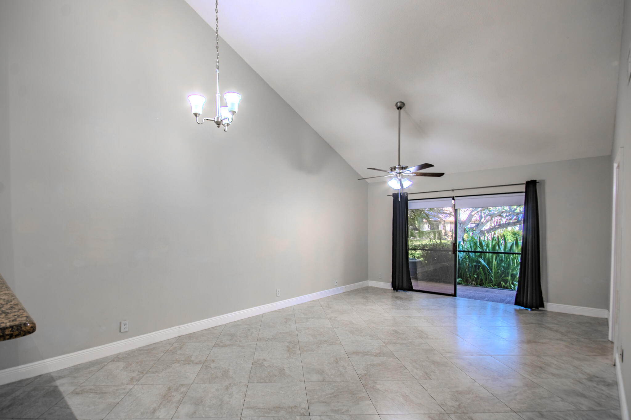 427 Cottonwood Place Boca Raton, FL 33431 - Photo 9 of 30 an empty room with windows and outdoor view