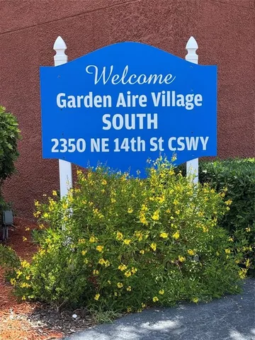 a sign that is next to a road