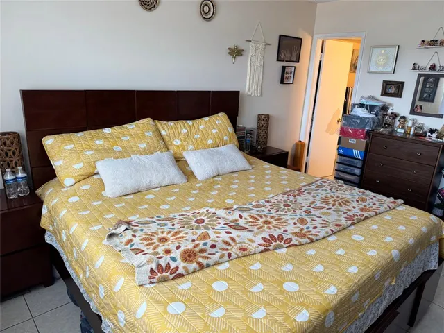 a bedroom with a bed and dresser