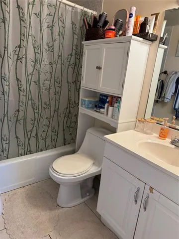 a bathroom with a toilet and a sink