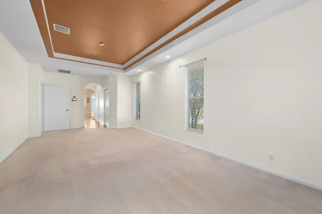 a white bath tub sitting next to a window