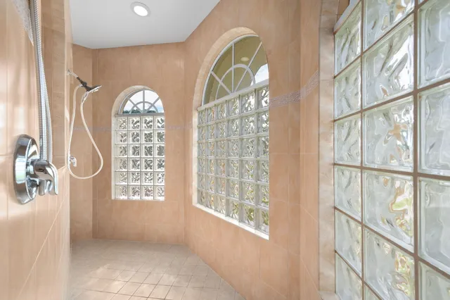 a view of a livingroom with a ceiling fan and window