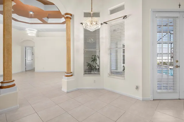 a kitchen with stainless steel appliances granite countertop a sink refrigerator and cabinets